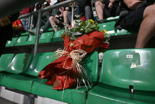 Representatives from Liverpool and AC Milan have put flowers on the seat of the Liverpool fan who passed away the day before