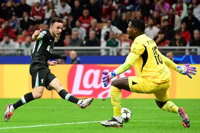 Diogo Jota misses the target in front of AC Milan's French goalkeeper #16 Mike Maignan