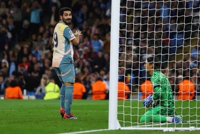 Gundogan looks at the linesman after missing a great chance