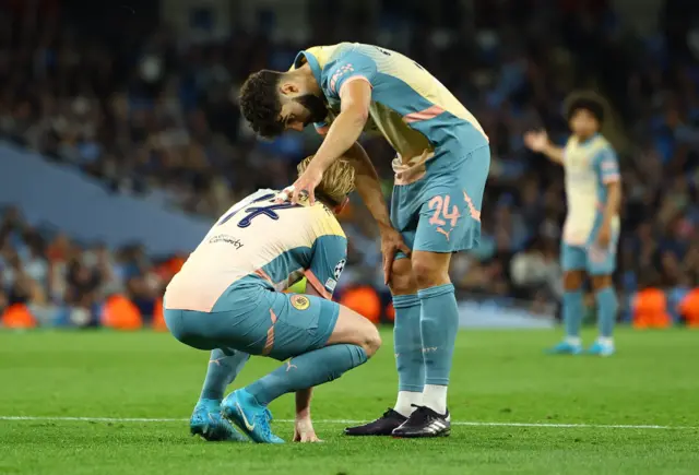 De bruyne is checked on by Gvardiol after pulling up