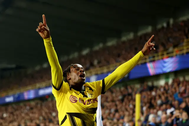 Gittens celebrates his goal in front of the Dortmund fans