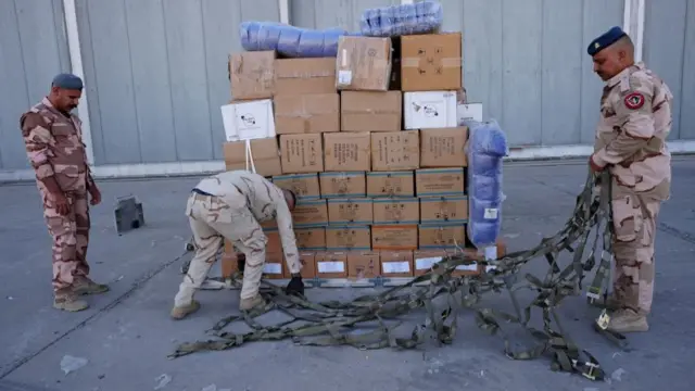 Iraqi security forces process emergency medical aid that will be shipped on a plane to Lebanon at a military airbase near Baghdad International Airport in Baghdad, Iraq, September 18, 2024