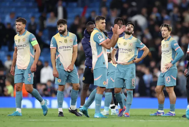 City players gather on the pitch at the end