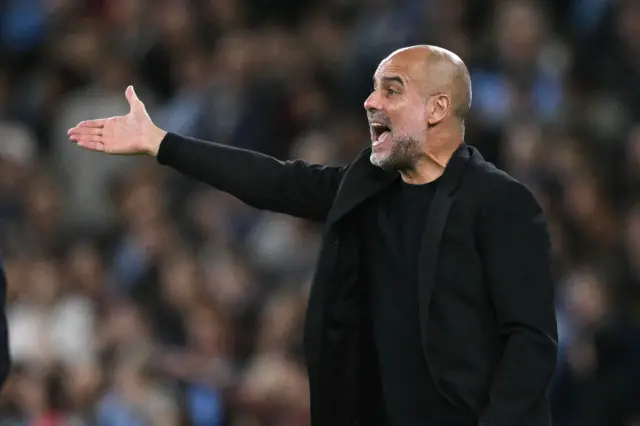 Guardiola shouts and points from the touchline