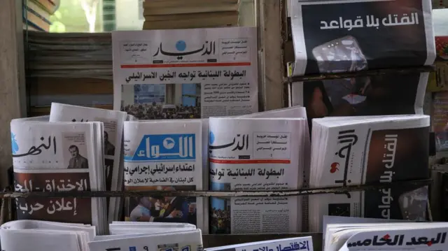 A newsstand shows headlines following pager detonations across Lebanon on Tuesday in Beirut