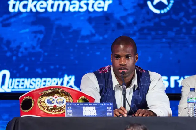 Daniel Dubois sits next to his IBF heavyweight title