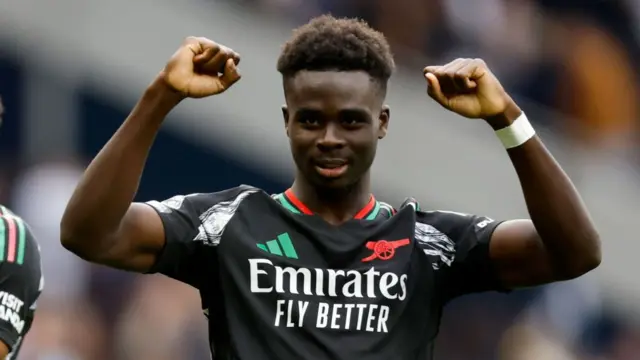 Bukayo Saka of Arsenal celebrates after winning the Premier League match between Tottenham Hotspur FC and Arsenal FC at Tottenham Hotspur Stadium on September 15, 2024 in London, England.