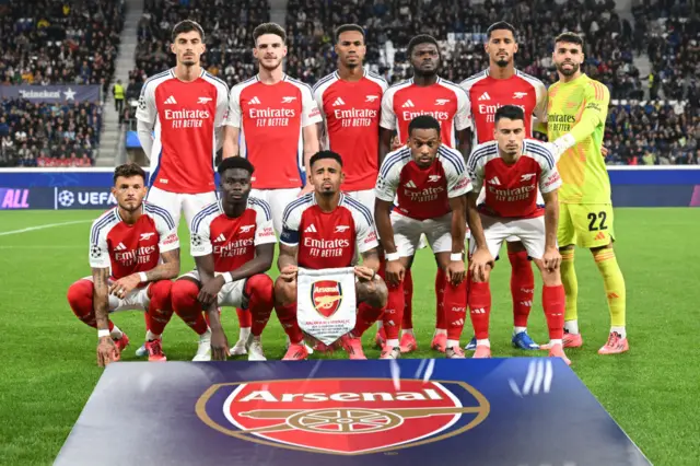 The Arsenal team line up for a photo