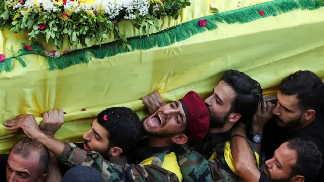 Men carry the coffin of Mohammad Mahdi Ammar, son of Hezbollah member of the Lebanese parliament, Ali Ammar, who was killed in the pager blasts on Tuesday