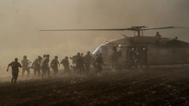 Israel's military evacuate injured people by helicopter after an anti-tank missile was fired into Israel from Lebanon