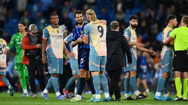 Erling Haaland of Manchester City reacts with Francesco Acerbi of FC Internazionale at the end of the UEFA Champions League 2024/25 League Phase MD1 match between Manchester City and FC Internazionale Milano at City of Manchester Stadium on September 18, 2024 in Manchester, England.