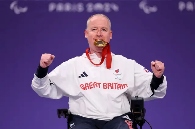 Stephen McGuire celebrates with his gold medal