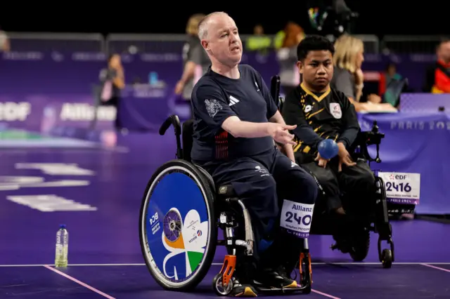 Stephen McGuire throws a boccia ball during the 2024 Paralympics