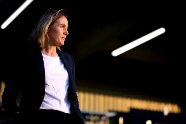 Sonia Bompastor walks to the dugout