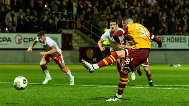 MOTHERWELL, SCOTLAND - SEPTEMBER 20: Motherwell's lennon Miller scores from the penalty spot to make it 2-1 during a Premier Sports Cup quarter-final match between Motherwell and Dundee United at Fir Park, on September 20, 2024, in Motherwell, Scotland. (Photo by Craig Foy / SNS Group)