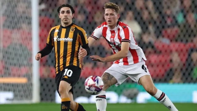 Stoke midfielder Wouter Burger closes down Hull's Abdulkadir Omur.