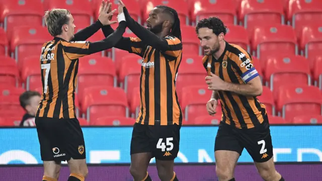 Kasey Palmer has a high 10 with Hull teammate Liam Millar.