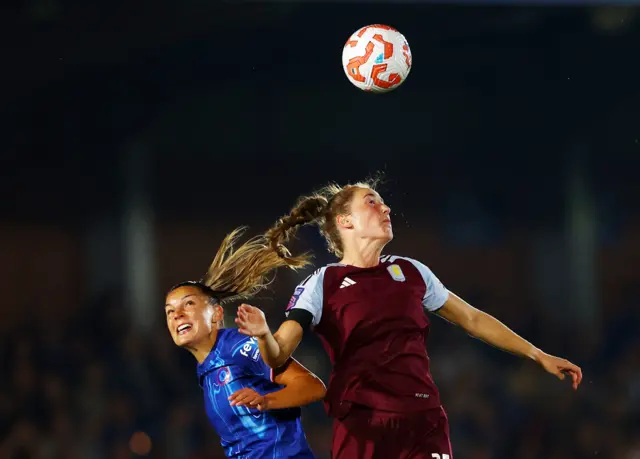 Parker beats Kaneryd to the ball in the air