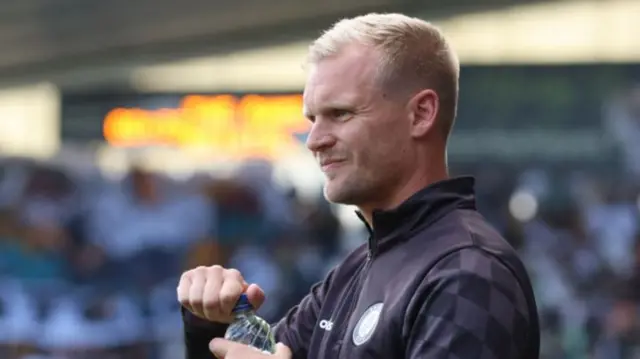 Liam Manning watches Bristol City on the touchline