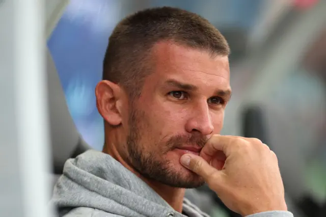 Dario Vidosic looks on from the bench deep in thought