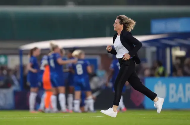 Bompastor runs across the pitch to the dugout