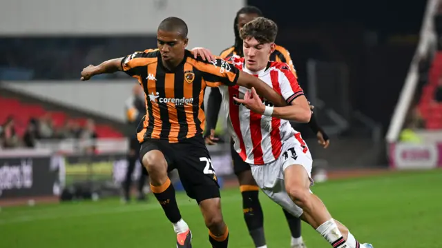 Stoke's Lewis Koumas battles with Hull defender Cody Drameh.