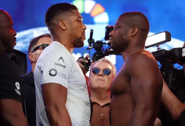 Anthony Joshua and Daniel Dubois stand face-to-face