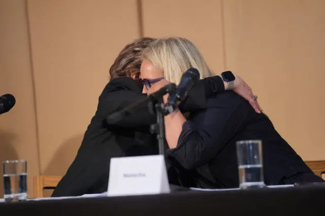 One of Fayed's accusers Natacha (right) is hugged by American attorney Gloria Allred at a press conference