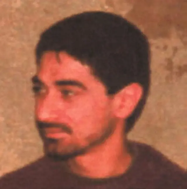 A fuzzy image of Ibrahim Aqil against a non-descript background