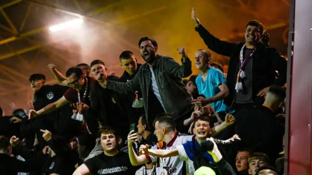 MOTHERWELL, SCOTLAND - SEPTEMBER 20: Motherwell fans celebrate a late winner during a Premier Sports Cup quarter-final match between Motherwell and Dundee United at Fir Park, on September 20, 2024, in Motherwell, Scotland. (Photo by Rob Casey / SNS Group)