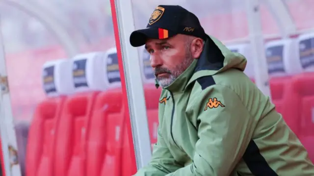 Hull City manager Tim Walter pictured sitting in the dugout at the Bet365 Stadium.