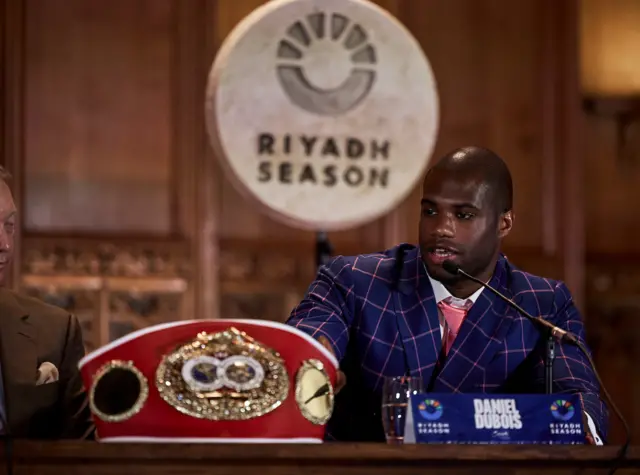 Daniel Dubois sits next to his IBF heavyweight title