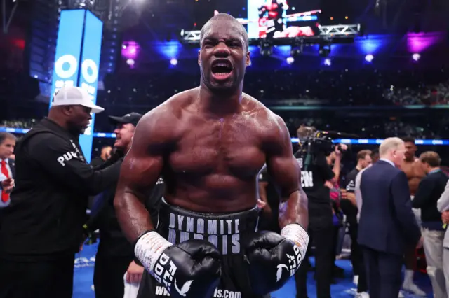 Daniel Dubois wearing black boxing gloves