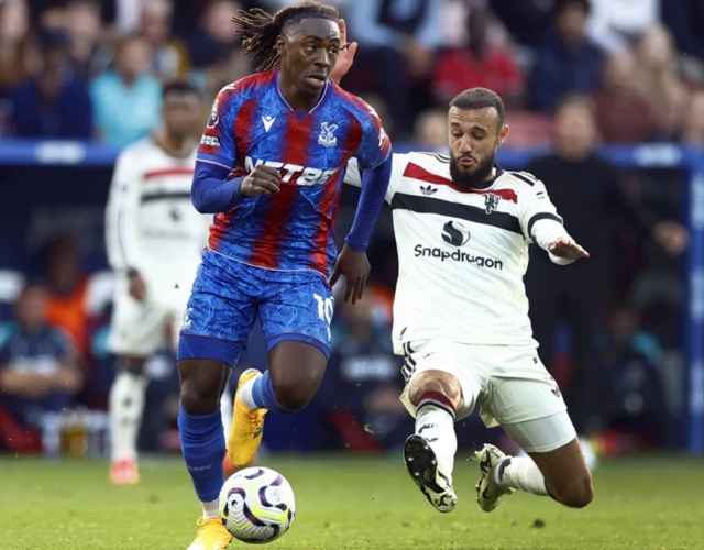 Eberechi Eze in action with Manchester United's Noussair Mazraoui