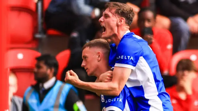 Taylor Gardner-Hickman screams in celebration as he jumps onto the back of Birmingham goalscorer Jay Stansfield.