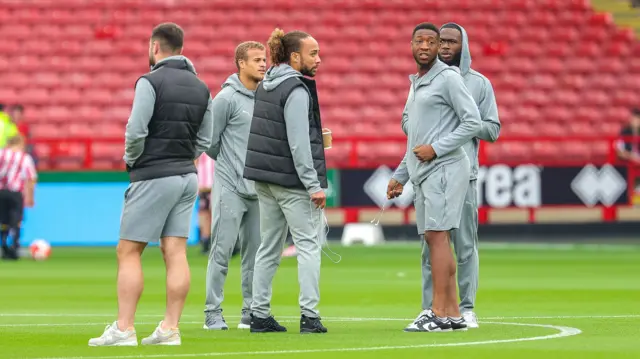 Derby players warm up at Bramall Lane