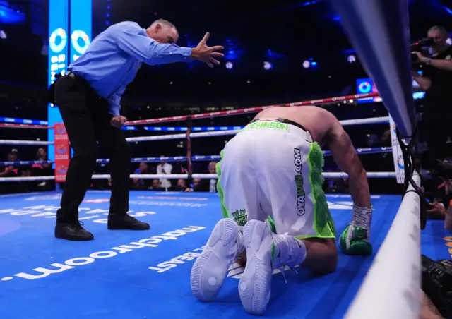 Willy Hutchinson on his knees in the ring