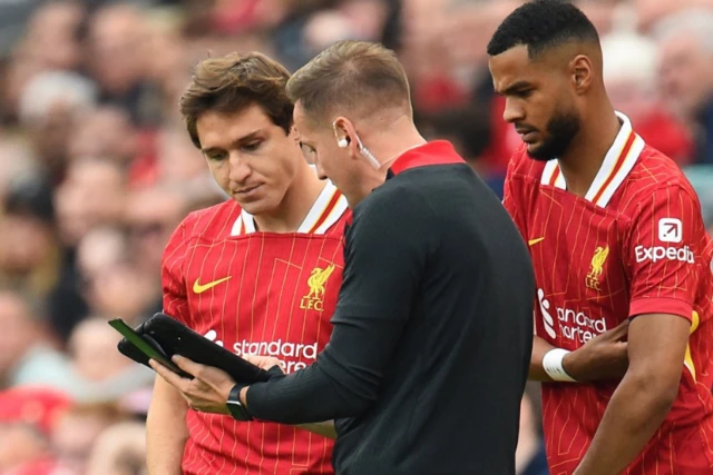 Federico Chiesa and Cody Gakpo before they come on as substitutes