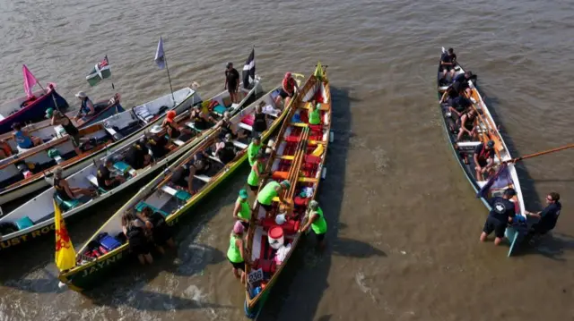 Overhead shot of seven boats on the water