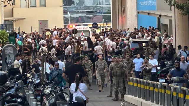 People, including soldiers, gathered outside a hospital in Beirut on Tuesday