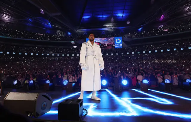 Anthony Joshua in his white robe