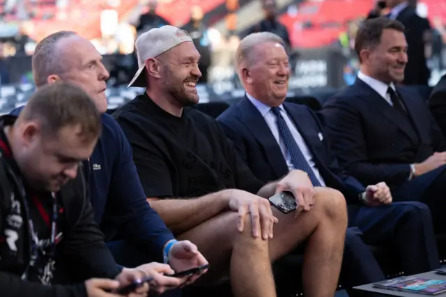 Tyson Fury grins at ringside