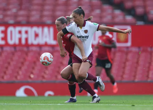 Terland battles Saez for the ball near the box