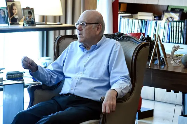 Lebanese caretaker Prime Minister Najib Mikati (L) speaks during a ministerial emergency meeting to discuss recent developments in southern Lebanon, at Mikati's residence in Beirut, Lebanon, 25 August 2024