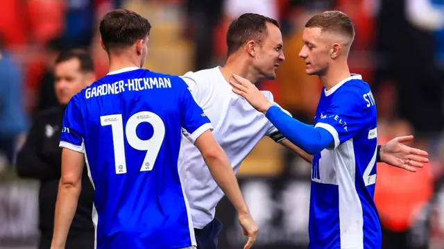 Jay Stansfield is congratulated by Birmingham City head coach Chris Davies.