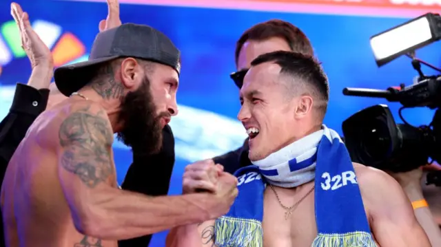 Cacace and Warrington shake hands during Friday's weigh-in at Trafalgar Square