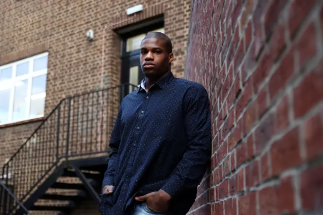 Daniel Dubois leans against a wall