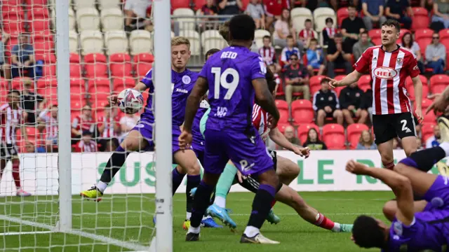 Exeter's Ed Francis converts from close range.