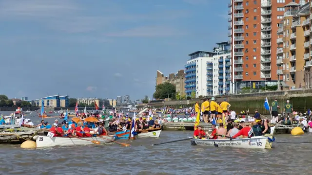 Numerous boats and crews on the water