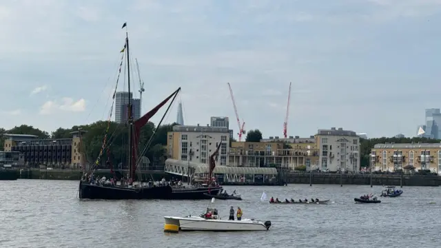 The first boats passing the yacht